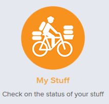 Icon featuring a cyclist with stacked items, enclosed in an orange circle.